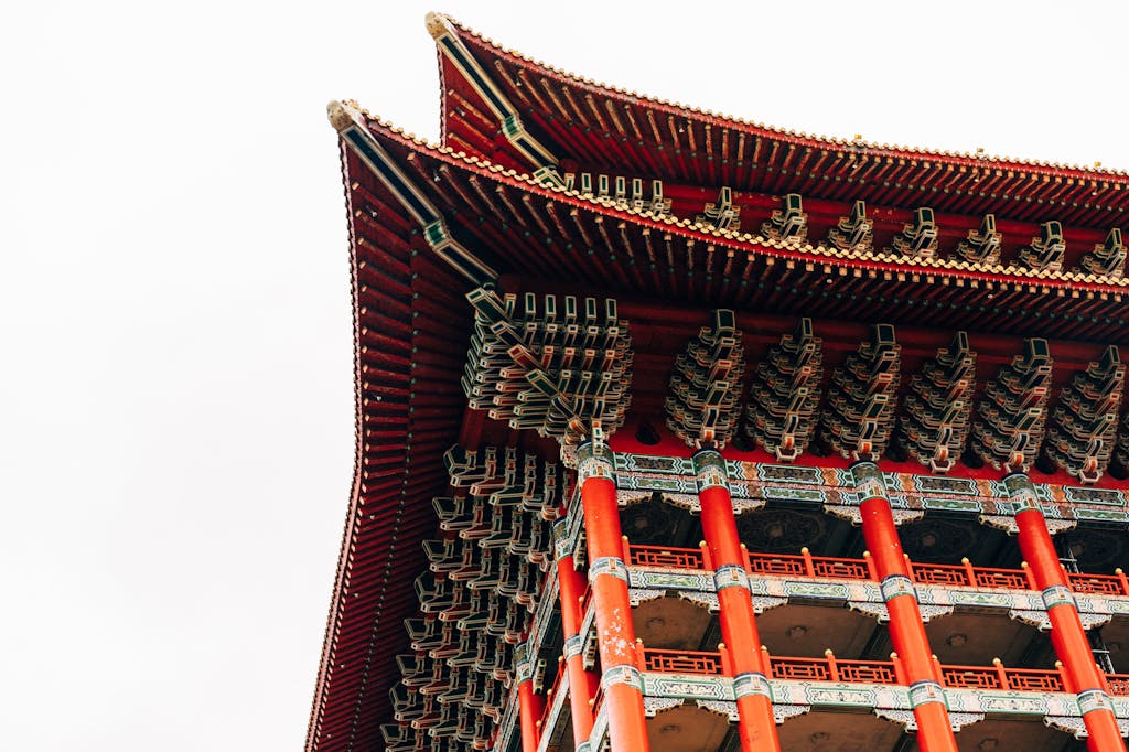 Close-up of a traditional temple's ornate roof in Taipei, showcasing intricate architectural design.